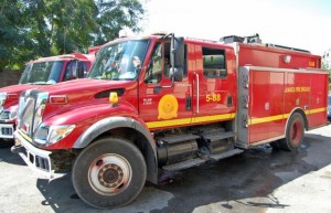 Firefighters investigating fire which destroyed sections of hardware store, in St. Andrew